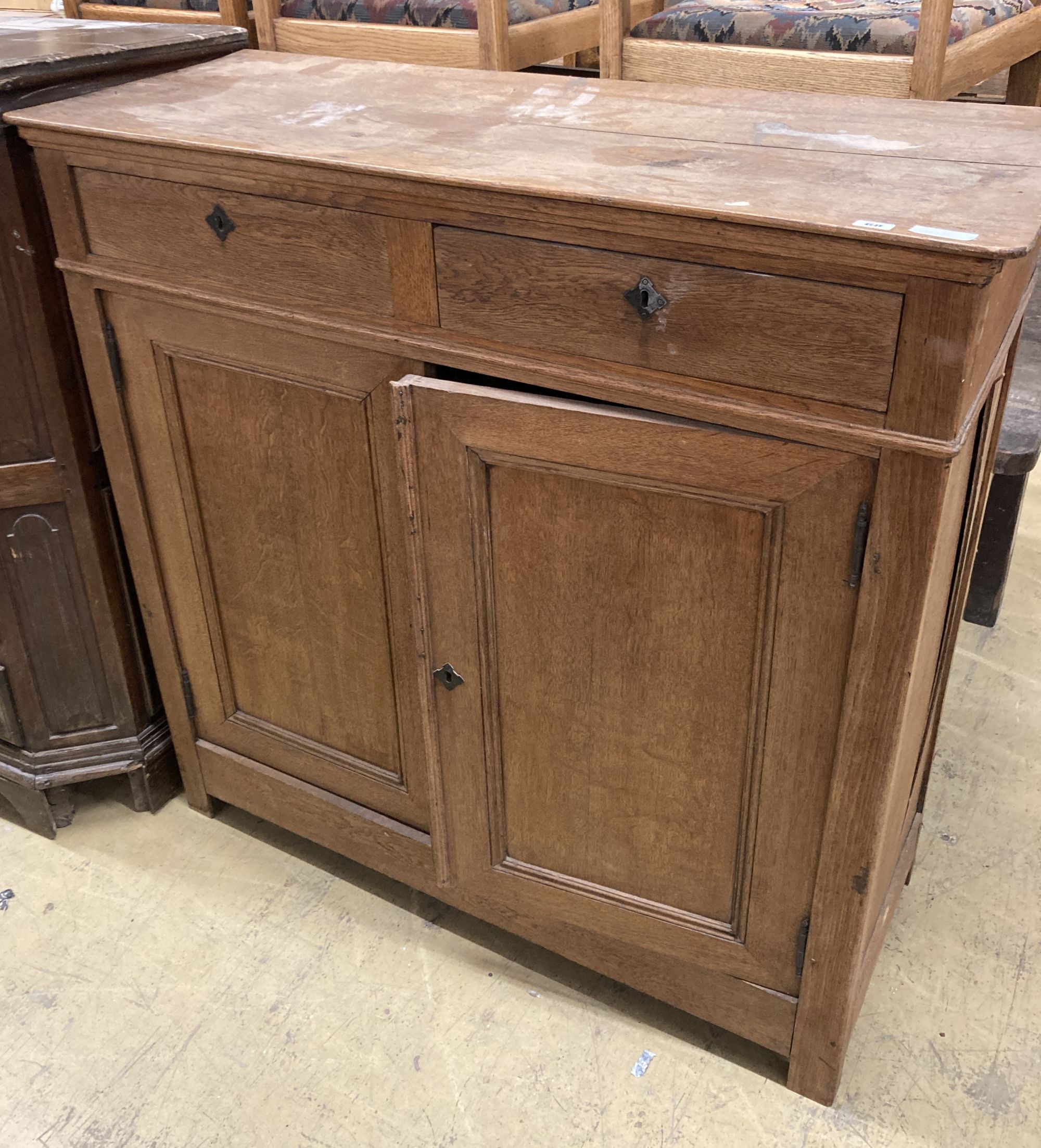 A 19th century Continental oak side cabinet